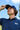 Golfer in the Oxford Navy Vintage golf polo and Navy Classic golf hat, looking up