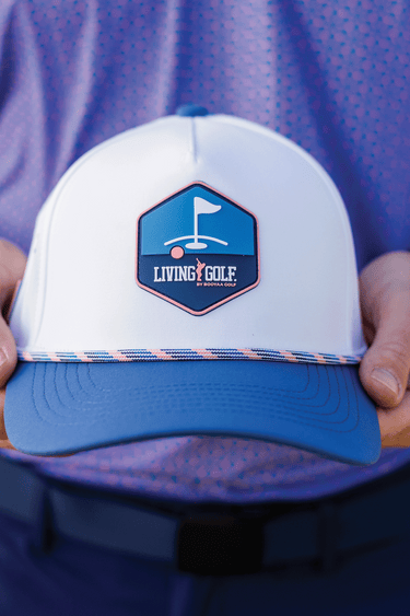 BooYaa Premium Golf Cap - COAST, white and blue cap, front detail in hands