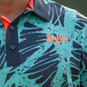 Bundu's Golf Polo, aqua, navy and orange golf shirt, on-model front detail