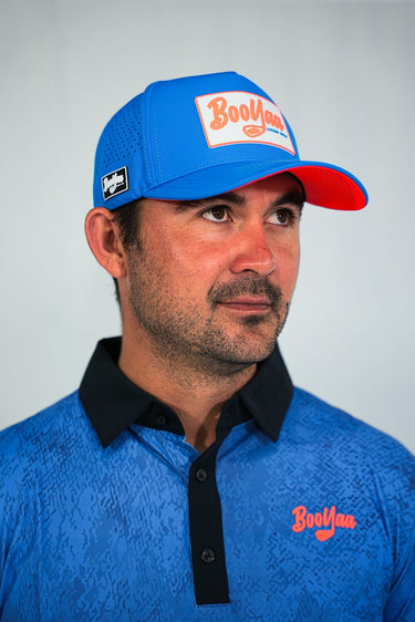 Gators Blue Hat, blue golf hat with orange underbrim, on-model three-quarter view