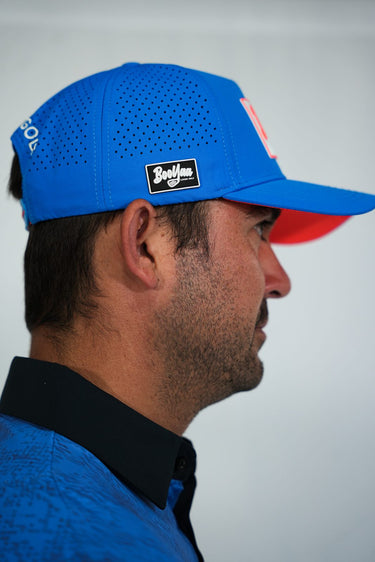 Gators Blue Hat, blue golf hat with orange underbrim, on-model side view
