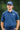 Golfer in the Oxford Navy Vintage golf polo and a navy BooYaa cap, front view