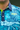 Azure Golf Polo, blue and neon green floral golf shirt, on-model front detail