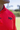 Close-up of the black BooYaa chest logo on the Tiger Red Vintage golf polo