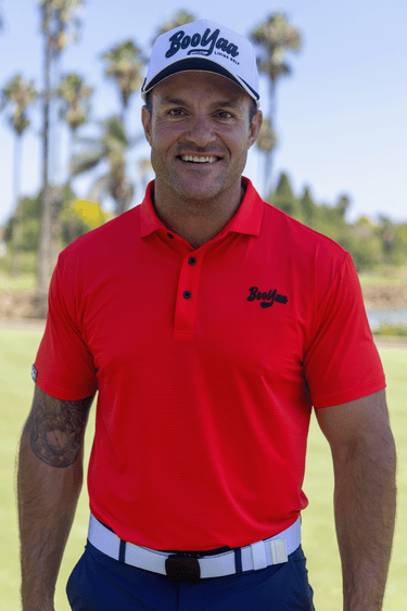 Golfer in the Tiger Red Vintage golf polo and White Classic golf hat, front view